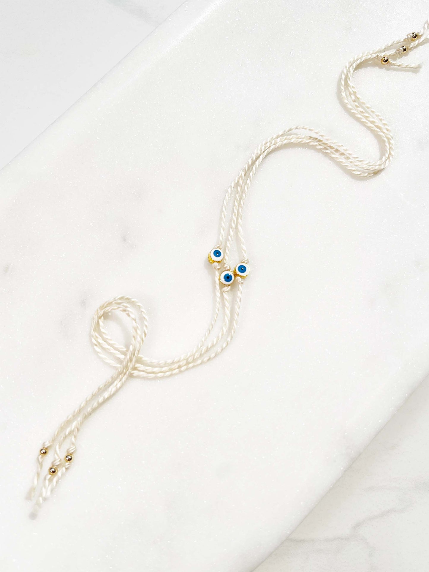 Mini White and Blue Evil Eye Rakhri 🧿