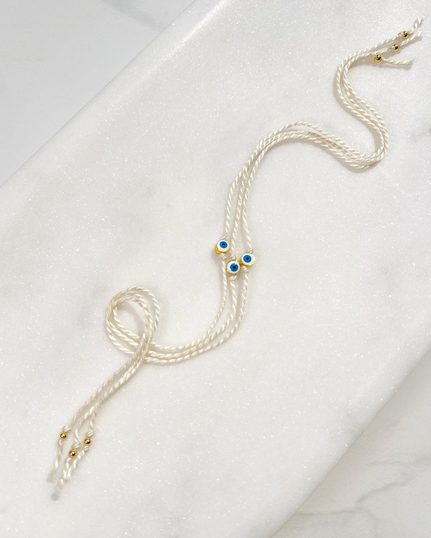 Mini White and Blue Evil Eye Rakhri 🧿