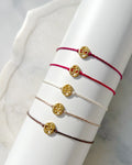 Gold Plated Oval Gold Plated Aum Rakhi