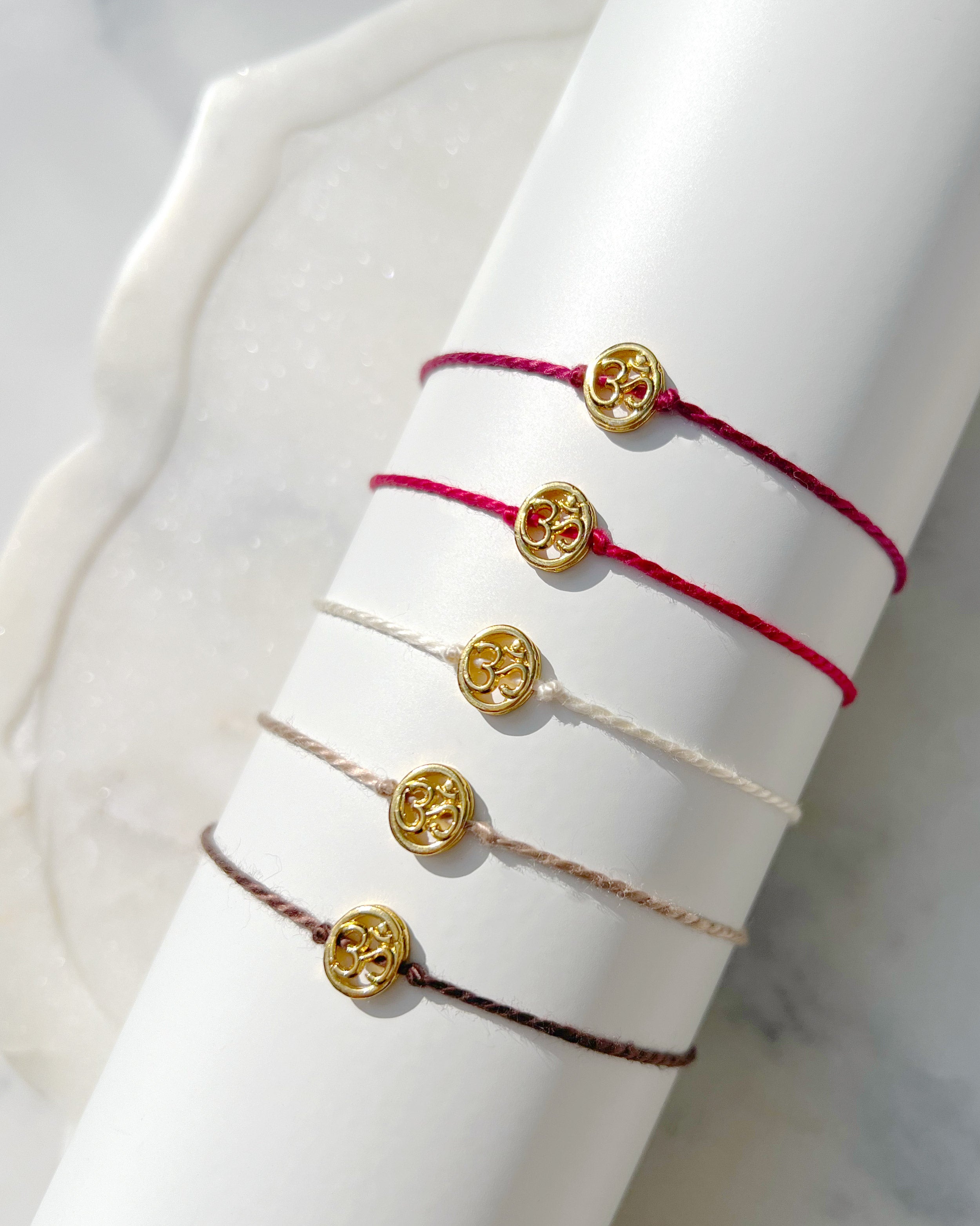 Gold Plated Oval Gold Plated Aum Rakhi