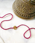 Gold Plated Oval Gold Plated Aum Rakhi